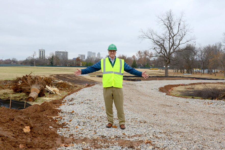 Jeff Stava, executive director of Tulsa’s Gathering Place, Llc, stands on land near riverside drive that eventually will be transformed into a gathering place. Photo by Natalie Green.