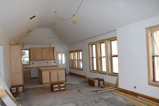 Walls seperating the living room, dining room and kitchen were removed to create one large space. Photos courtesy John Beedon.