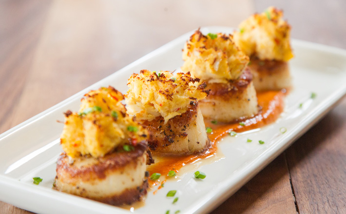 Stuffed scallops with red pepper coulis is among the seafood selections at Broadway 10. Photos by Brent Fuchs.