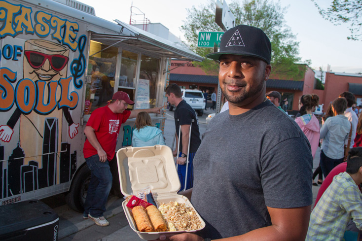 Co-owner Ricki Bly displays a meal from Taste of Soul Egg Roll. Photo by Brent Fuchs.