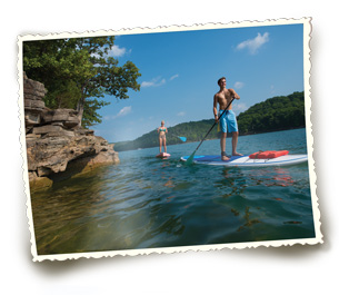 Visitors of Beaver Lake enjoy a day on the water with paddleboards. Photo courtesy Arkansas department of Parks and tourism.