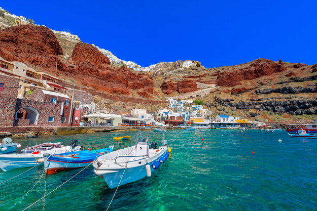 Fishing boats are gathered in the fishing village of Cyclades on Santorini.