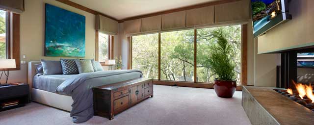 Among the special bedroom furnishings are a bed from the Williams-Sonoma Collection, night stands and bedding from Restoration Hardware, a contemporary painting and a teak chest.