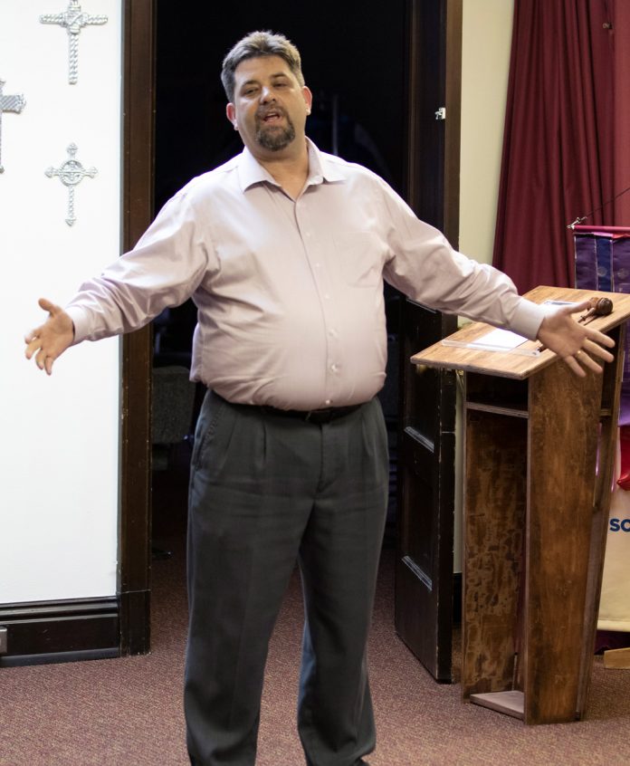 Rob Trotter flexes his public speaking skills at a gathering.