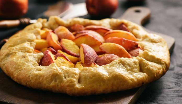 Homemade rustic galette with peaches.