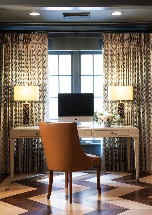 A small study area features the two-tone herringbone patterned floor that is echoed in the den. Photo by Jenifer Jordan.
