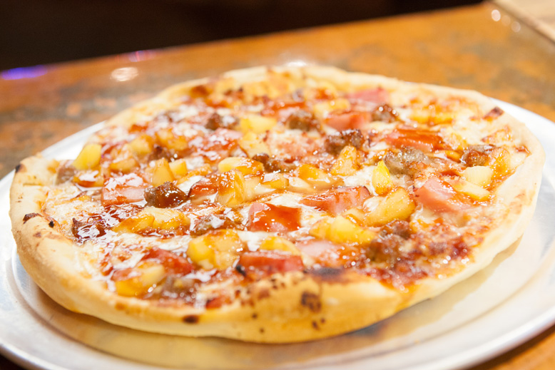 piping hot pizza pie is on the menu at Jo’s Famous pizza. Photo by Brent Fuchs.