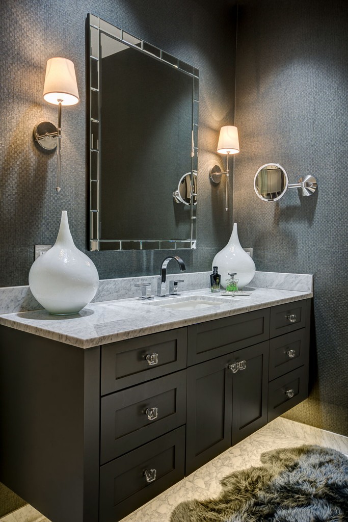 The marble master bath has a lighted makeup mirror with a high-tech motion sensor that turns as someone approaches.
